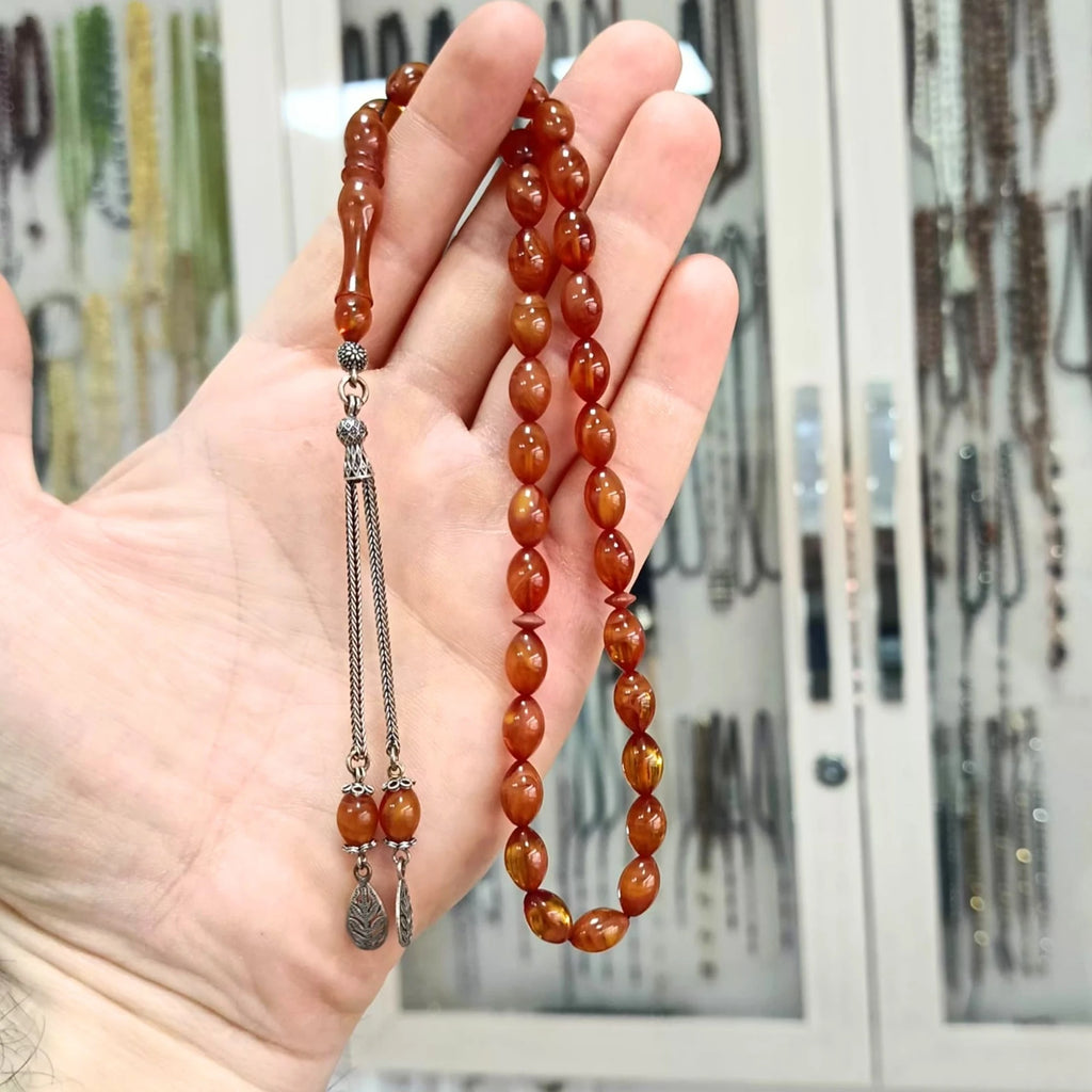 Gümüş Püsküllü Oval Kesim Sıkma Ateş Kehribar Tesbih 7 X 10 mm